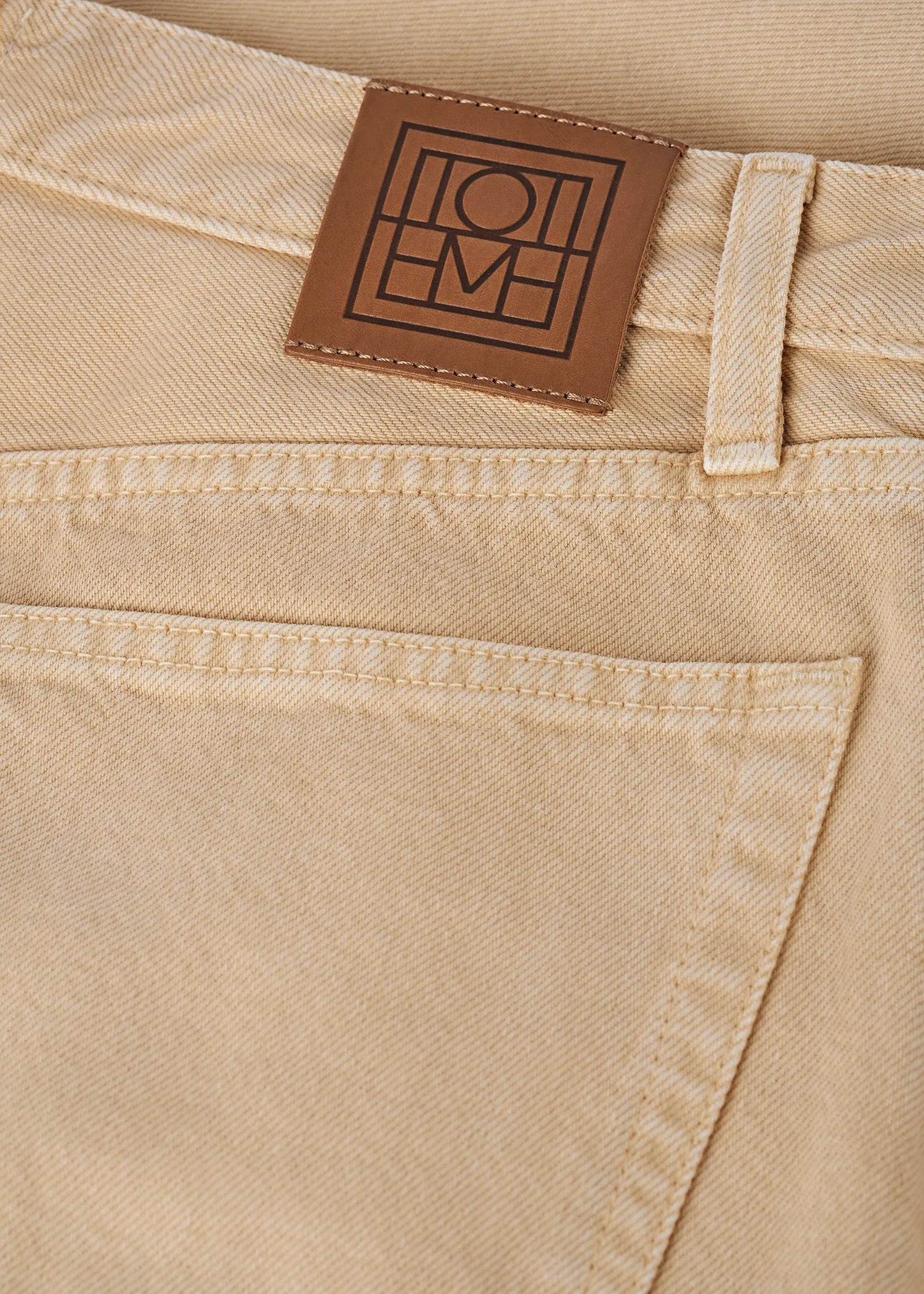 Twisted seam denim full length washed beige